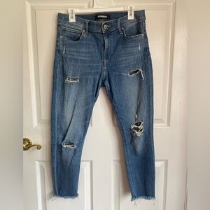 Medium wash express jeans with distressed detail - size 10